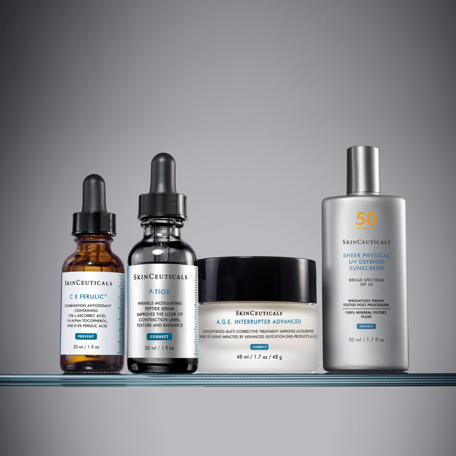 A lineup of four SkinCeuticals skincare products: CE Ferulic serum, Blemish + Age Defense serum, A.G.E. Interrupter Advanced cream featuring P-TIOX technology, and Sheer Physical UV Defense Sunscreen SPF 50.